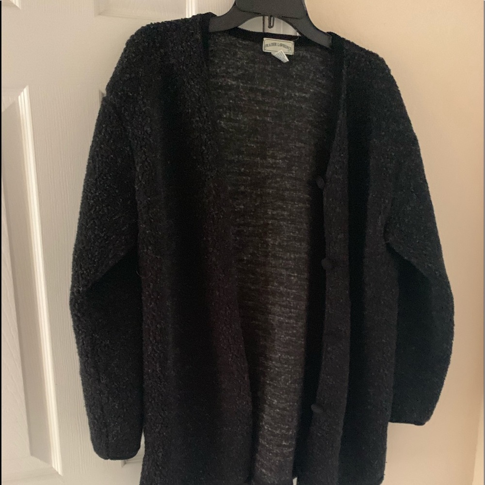 Jacket. Black. No pockets. “Warm and cozy”.